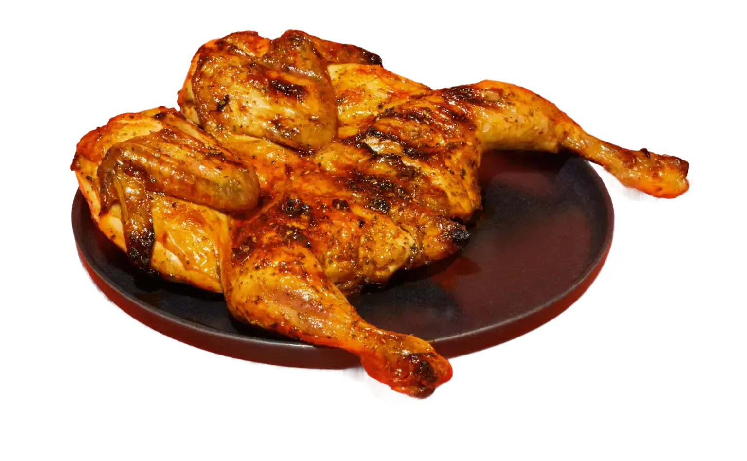 Poulet braisé entier, doré et grillé, servi sur une assiette